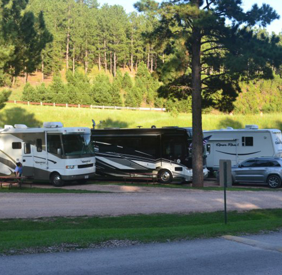 RVs parked at Holy Smoke Resort in the Black Hills of South Dakota with full hook ups